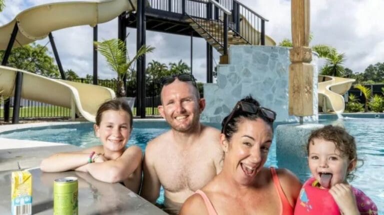 Ross and Lauren Jewell with their daughters Emilia and Rylee at home at Burpengary East. The family has sold their property with a standout pool and waterslides. Picture: Richard Walker
